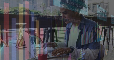 Image of statistics and data processing over man using laptop