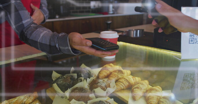 Image of spots of light over man serving coffee working in cafe