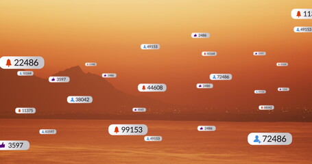 Image of social media icons over sunset and sea landscape