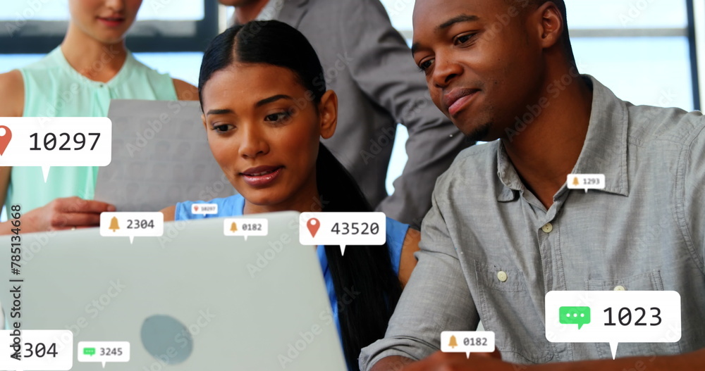 Poster composite of notification icons with changing numbers over diverse colleagues discussing over laptop