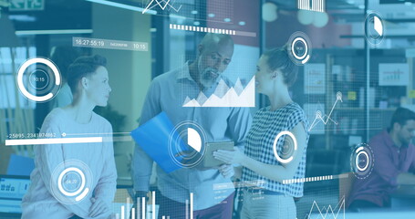 Image of graphs, loading circles and graphs over diverse coworkers discussing reports