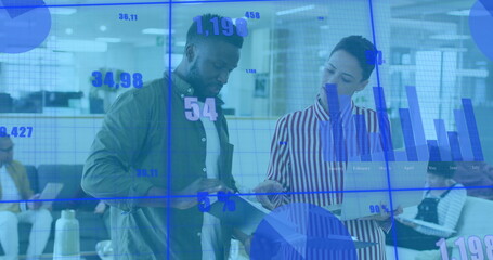 Image of graphs and changing numbers over diverse coworkers standing and discussing reports