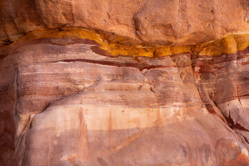 Sandstone rock and mineral layers in Petra, Jordan