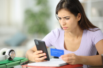 Worried student buying online at home