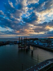 Fototapeta premium Vertical shot of a bridge at sunset