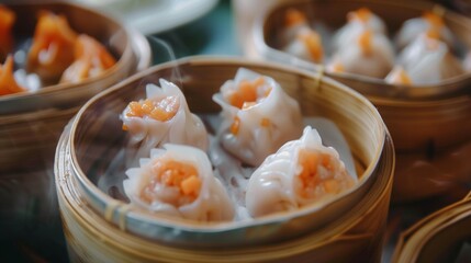 dim sumi and shrimp dumplings in steamers on a table - obrazy, fototapety, plakaty
