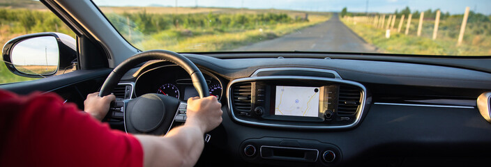 The driver follows the directions of the navigator, photo from inside the car, stock photo