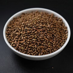 Fototapeta premium Celery seeds on a black background.