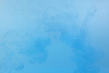 Blue color dye melt on white background,Abstract smoke pattern,Colored liquid dye,Splash paint