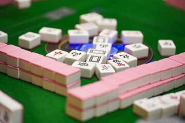 Selective focus shot of mahjong tiles on a table