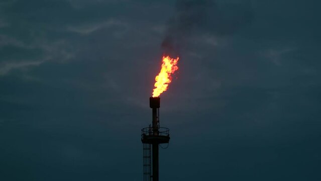 Methane gas flare flame combustion natural oil production industry night