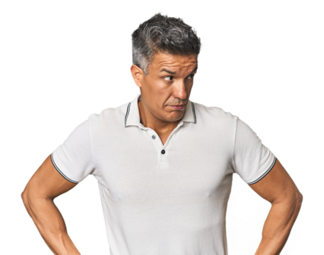 Middle-aged Latino man confused, feels doubtful and unsure.