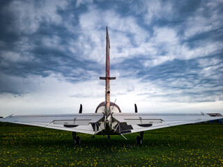 airplane on the runway. tail, aircraft stabilizer, rudder, 5 passenger light 2-engine aircraft