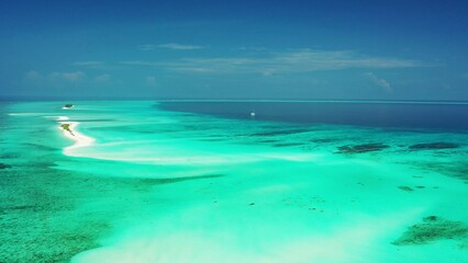 Fototapeta na wymiar Aerial view of magical blue ocean on a sunny summer day
