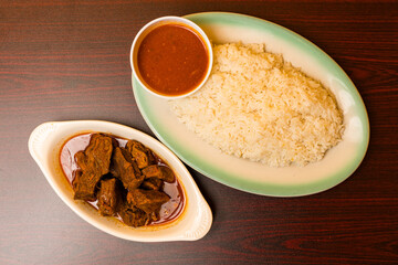Stewed beef with white rice and beans