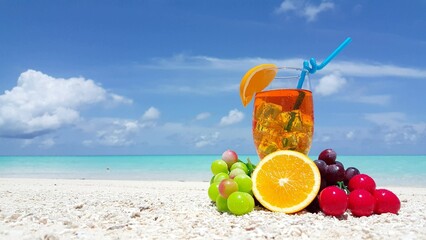 Closeup of a tasty cocktail with fruits at a beach on a sunny day