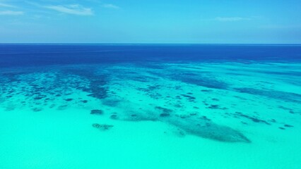 Seascape of coral reefs under tranquil water in the sea