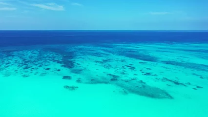 Gordijnen Seascape of coral reefs under tranquil water in the sea © Wirestock
