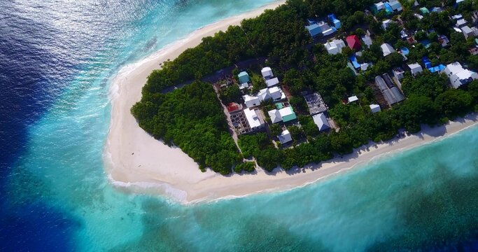 Top view of Ukulhas island in Maldives with white sandy beach