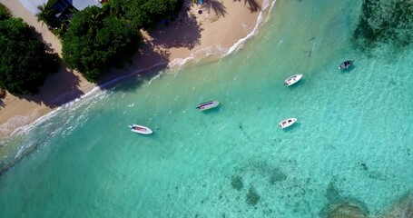 Aerial shot of boats parked by the beach