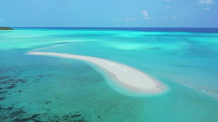 Beautiful shot of turquoise sea under cloudy sky in the Maldives