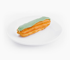 Fresh pistachio Éclair on white plate