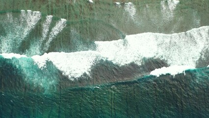 Aerial top view of ocean waves in storm in the Maldives - obrazy, fototapety, plakaty