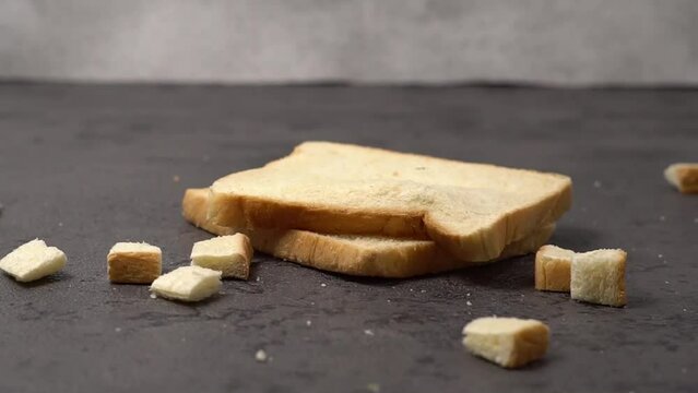 diced bread falls on top of the bread