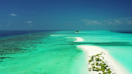 Top view of small sandbanks in the shallow algal ocean water in Asia