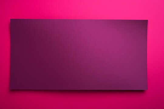 Magenta background with dark magenta paper on the right side, minimalistic background, copy space concept, top view