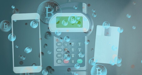 Image of bitcoins over smartphone and payment terminal