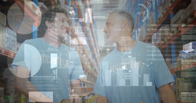 Image of financial graphs over happy caucasian male warehouse workers