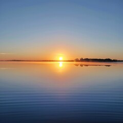Obraz premium sunset over the river