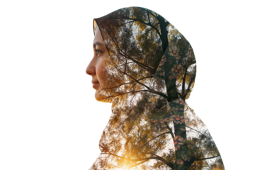 Double exposure of Muslim woman wearing hijab and tree silhouette