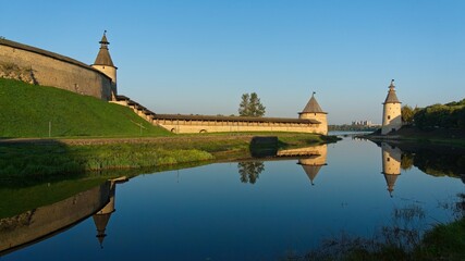 Pskov, Russia, September 11, 2023. The fortress moat near the Kremlin walls at dawn.                               - obrazy, fototapety, plakaty