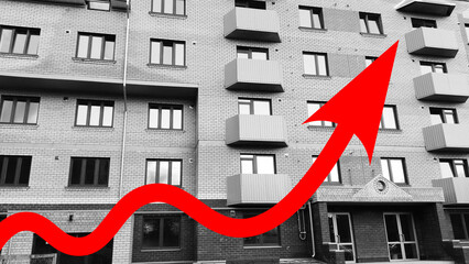 Red growing up large arrow on residential building monochrome background. Rising prices for...