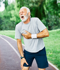 senior man running exercising sport fitness chest pain heart attack
