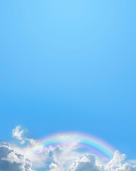 Blue sky and rainbow message board background - ideal for spiritual holistic or holiday advert template with clouds and a rainbow along the bottom plus copy space above for text content - 785209607