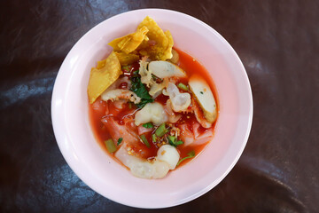 noodles with fish ball , jellyfish and fried wonton