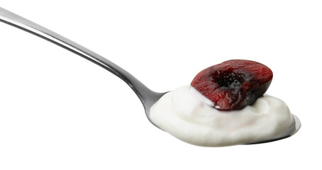 Spoon with yogurt and cherry isolated on white