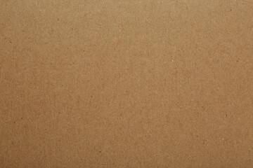 Kraft paper notebook sheet as background, top view