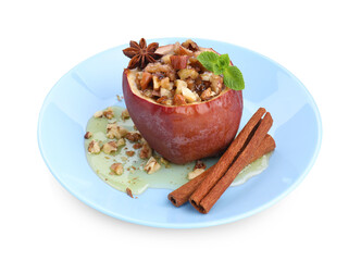 Tasty baked apple with nuts, honey, spices and mint isolated on white