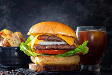 Burger with fries and drink, smash burger in black background