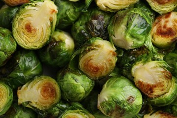Delicious roasted Brussels sprouts as background, top view