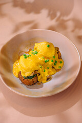Eggs benedict on toast with hollandaise sauce