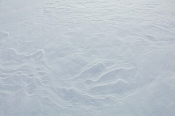 Wind has made patterns on snow surface.