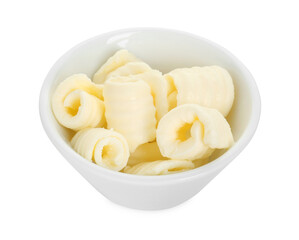 Tasty butter curls in bowl isolated on white
