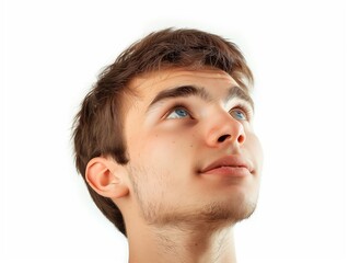 Obraz premium Young man looking up on white background, closeup portrait of face with eyes and eyebrows, handsome young guy, brown hair, studio shot, high resolution photography