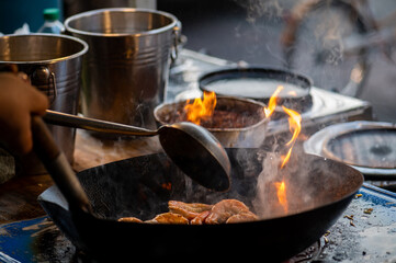 Pad Thai favorite and famous Asian Thai street fast food in hot pan, Pad Thai is stir fried rice noodle dish commonly served as a street food and at casual local eateries in Thailand