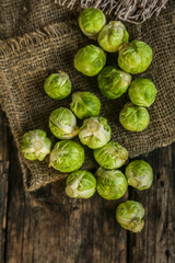 Brussels sprouts vegetables on a wooden background.